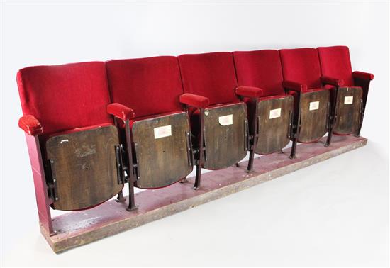 A bank of six folding seats, removed from The Royal Opera House, Covent Garden,